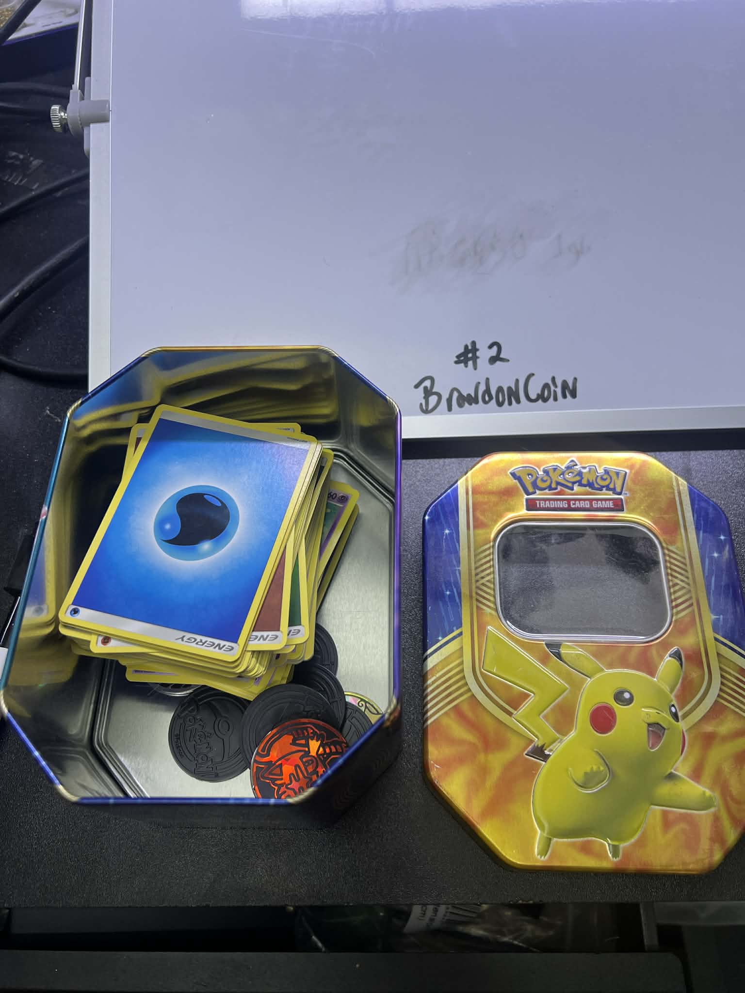 Pokemon Tin with random cards pikachu top